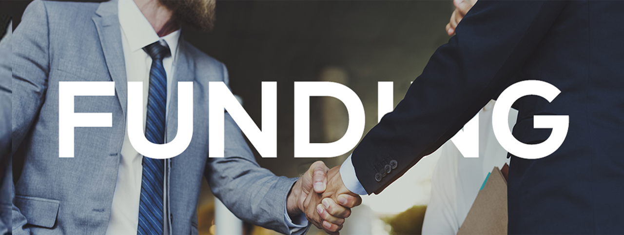 Two people shake hands, the photo intersected by the word 'Funding'