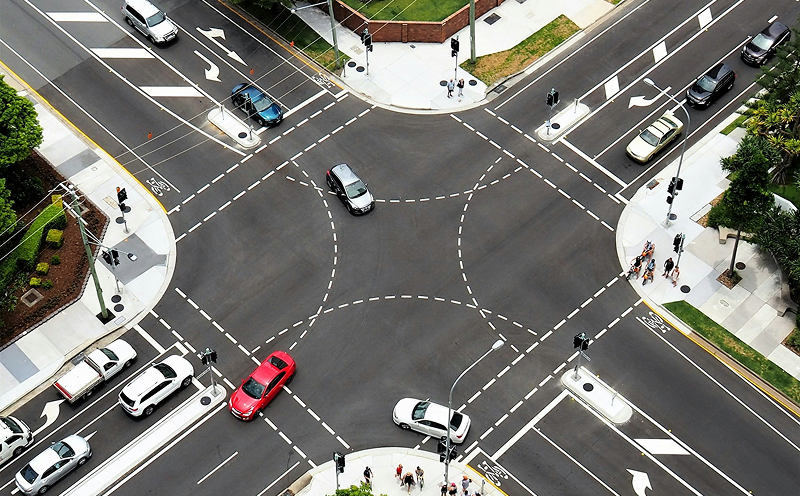 A traffic junction showing cars turning left and right