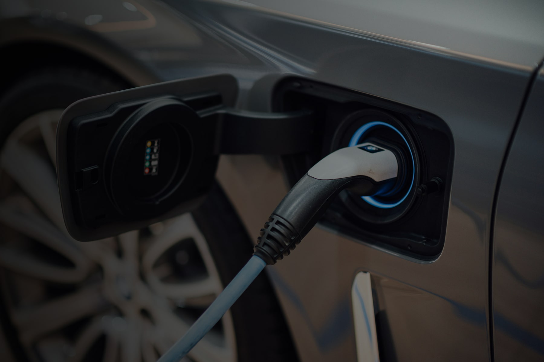A close-up of an electric vehicle being charged