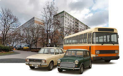 Three vehicles emerging from a road